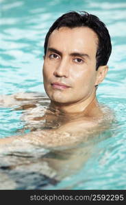Portrait of a mature man swimming in a swimming pool