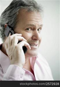 Portrait of a mature man talking on a mobile phone