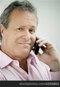 Portrait of a mature man talking on a mobile phone