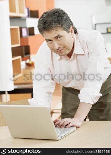 Portrait of a mature man using a laptop