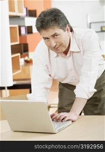 Portrait of a mature man using a laptop