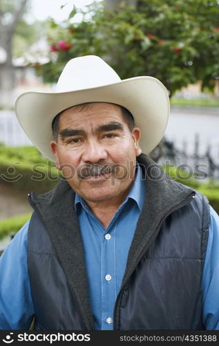 Portrait of a mature man wearing a cowboy hat