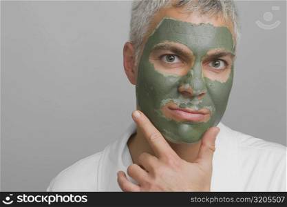 Portrait of a mature man wearing a facial mask