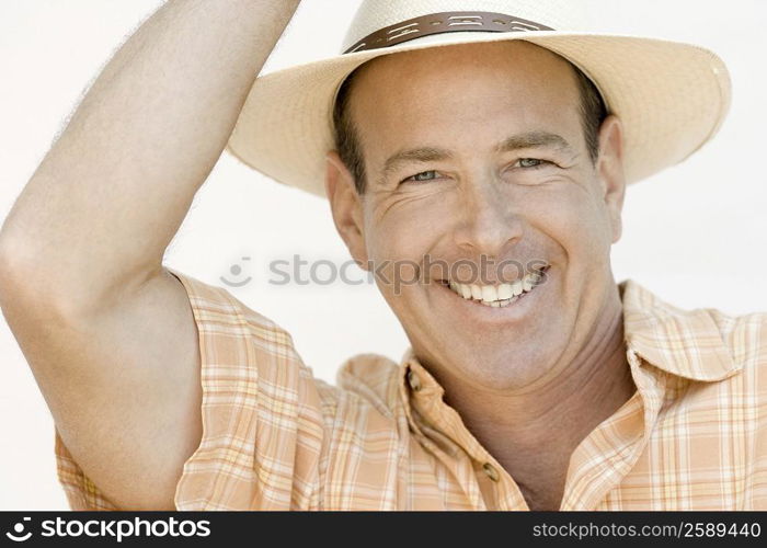 Portrait of a mature man wearing a hat and smiling