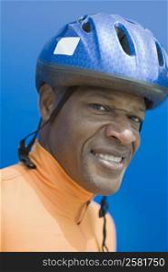 Portrait of a mature man wearing a sports helmet