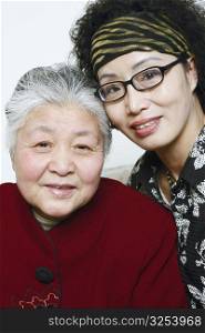 Portrait of a mature woman and a senior woman posing