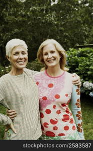 Portrait of a mature woman and a senior woman smiling