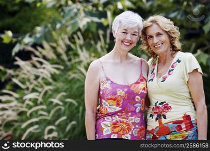 Portrait of a mature woman and a senior woman smiling