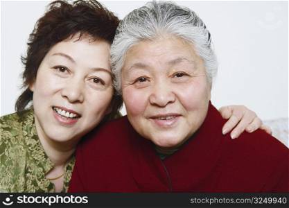 Portrait of a mature woman and a senior woman smiling