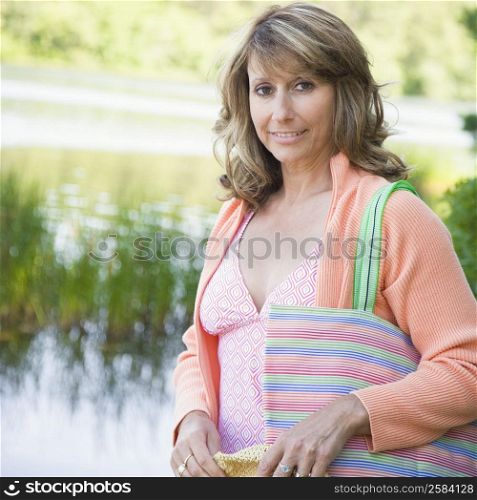 Portrait of a mature woman carrying a bag