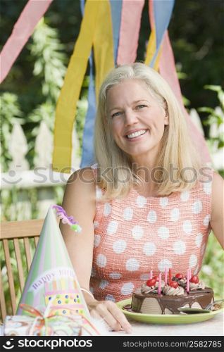 Portrait of a mature woman celebrating her birthday