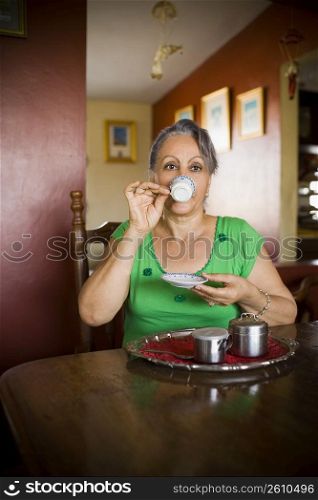 Portrait of a mature woman drinking a cup of tea