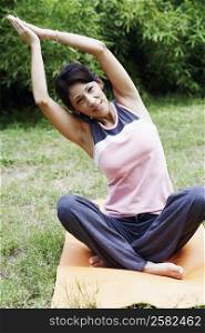 Portrait of a mature woman exercising on the lawn