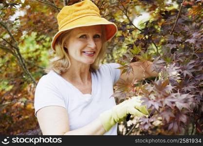 Portrait of a mature woman gardening and smiling
