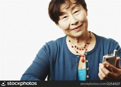 Portrait of a mature woman holding a mobile phone