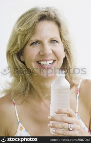 Portrait of a mature woman holding a water bottle