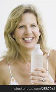 Portrait of a mature woman holding a water bottle
