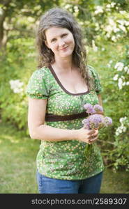 Portrait of a mature woman holding flowers