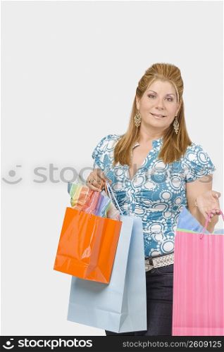Portrait of a mature woman holding shopping bags