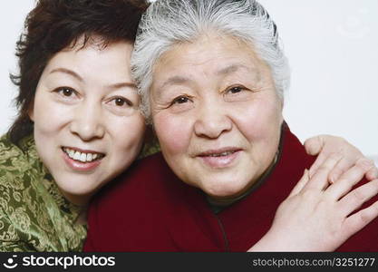 Portrait of a mature woman hugging a senior woman