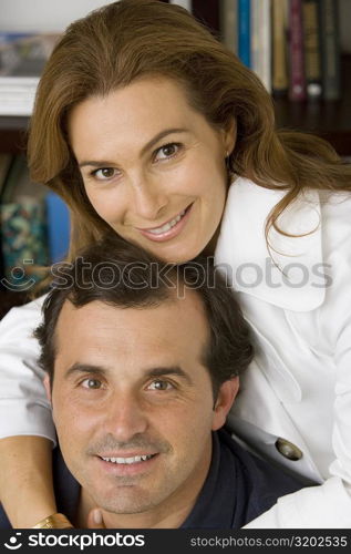 Portrait of a mature woman hugging her husband and smiling