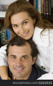 Portrait of a mature woman hugging her husband and smiling