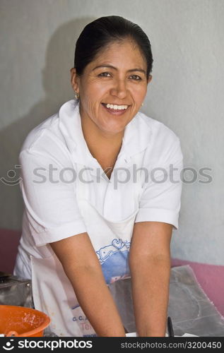 Portrait of a mature woman in a domestic kitchen, Real De Asientos, Aguascalientes, Mexico