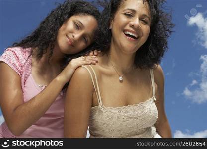 Portrait of a mature woman laughing with her daughter