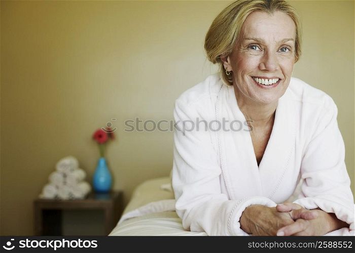 Portrait of a mature woman lying on a massage table and smiling