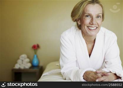 Portrait of a mature woman lying on a massage table and smiling