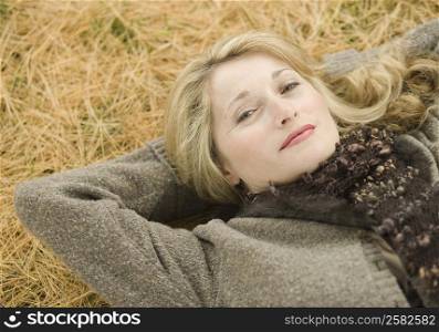 Portrait of a mature woman lying on grass