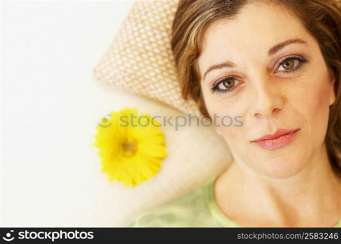 Portrait of a mature woman lying on the bed