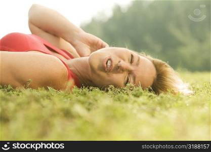 Portrait of a mature woman lying on the grass