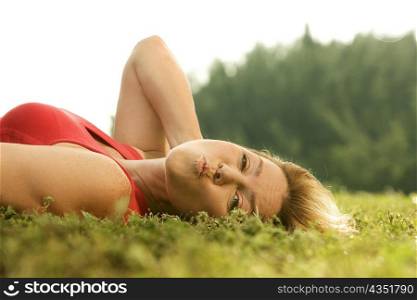 Portrait of a mature woman lying on the grass
