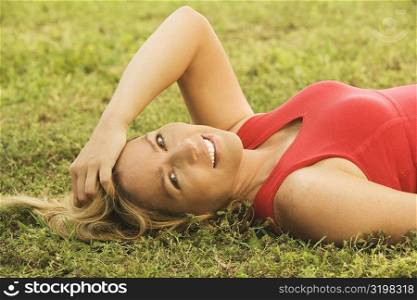 Portrait of a mature woman lying on the lawn