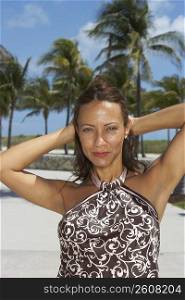 Portrait of a mature woman posing on the beach, South Beach, Miami Beach, Florida, USA