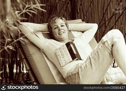 Portrait of a mature woman reclining on a lounge chair