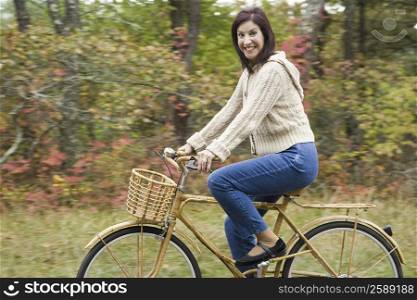 Portrait of a mature woman riding a bicycle and smiling