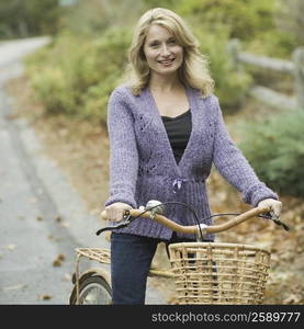 Portrait of a mature woman riding a bicycle and smiling