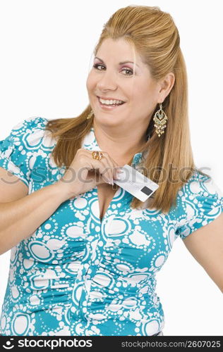 Portrait of a mature woman showing a credit card and smiling