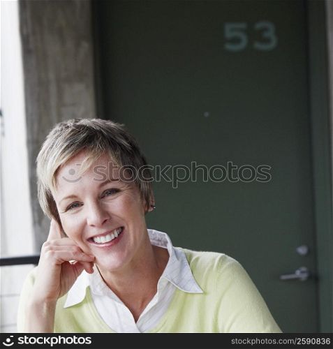Portrait of a mature woman sitting at the table and smiling