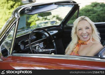 Portrait of a mature woman sitting in a car