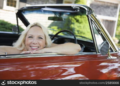 Portrait of a mature woman sitting in a car