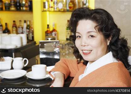 Portrait of a mature woman sitting in a restaurant