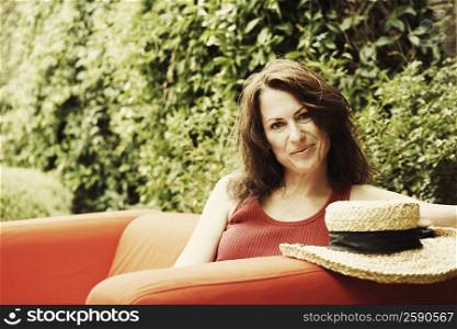Portrait of a mature woman sitting in an armchair
