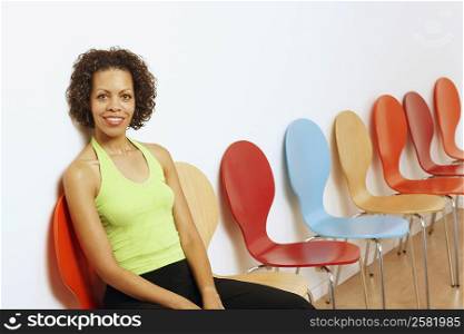 Portrait of a mature woman sitting on a chair