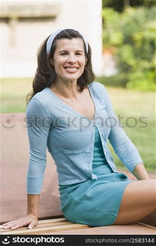 Portrait of a mature woman sitting on a lounge chair