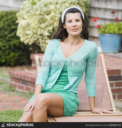 Portrait of a mature woman sitting on a lounge chair