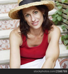 Portrait of a mature woman sitting on a staircase