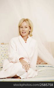 Portrait of a mature woman sitting on the bed